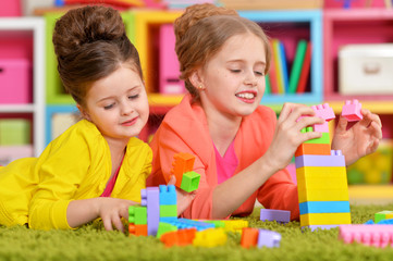 Fototapeta premium girls playing with colorful blocks