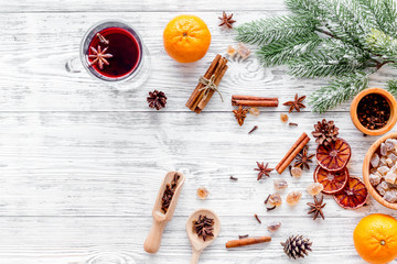 Merry christmas in winter evening with warm drink. Hot mulled wine or grog with fruits and spices...