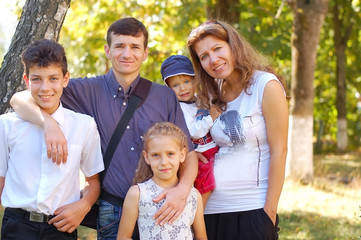Happy family on the nature in the summer