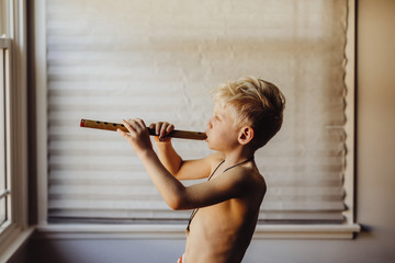 boy playing flute