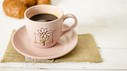 Pink cup of coffee