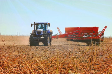 combine harvester, working on the harvest of a ripe sunflower. Agriculture. Cultivated area.