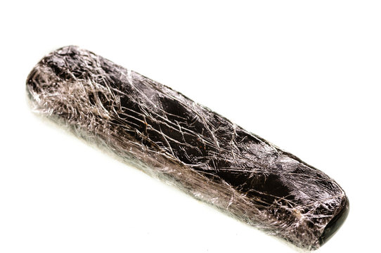 Block/brick of cannibis resin wrapped in cling film
