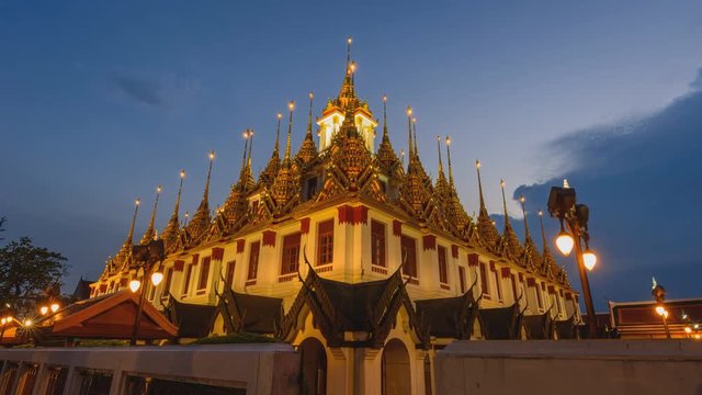 Day to night time lapse Golden pagoda in Wat Ratcha Nadda Temple / public temple landmark