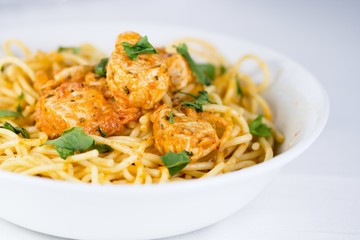 Spaghetti with chicken meat and cream sauce