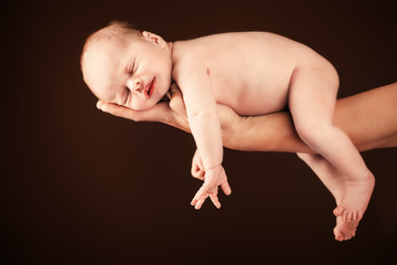 Obraz premium baby on fathers hand