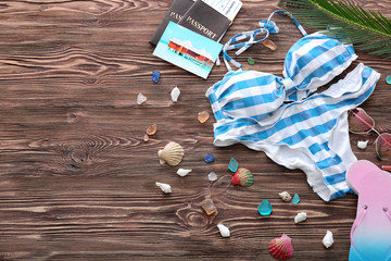 Composition with beach accessories on wooden background. Summer vacation concept