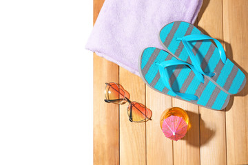 Composition with beach accessories on wooden background. Summer vacation concept
