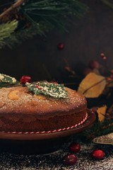 Christmas fruit cake on Holiday background