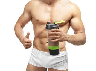 Fototapeta na wymiar Muscular man with protein shake on white background