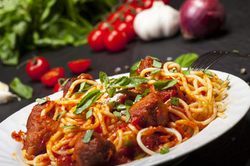 Spaghetti pasta with meatballs and tomato sauce