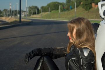 Fototapeta premium Sexy biker girl in a leather jacket