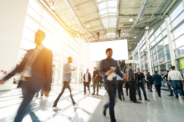 blurred visitors at a trade fair
