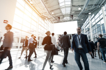 blurred visitors at a trade fair