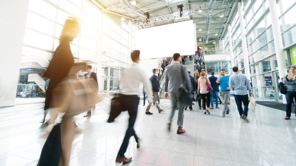 blurred visitors at a trade fair