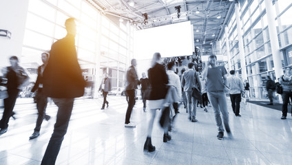 blurred visitors at a trade fair