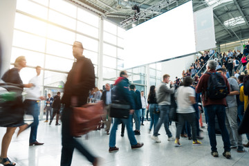 blurred visitors at a trade fair
