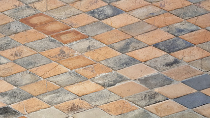 Colorful cobblestone road pavement, background photo texture.