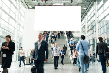 blurred visitors at a trade fair