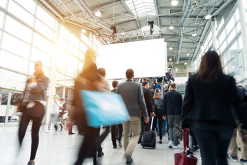 blurred visitors at a trade fair