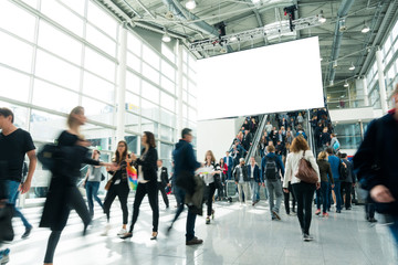 blurred visitors at a trade fair
