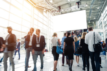 blurred visitors at a trade fair