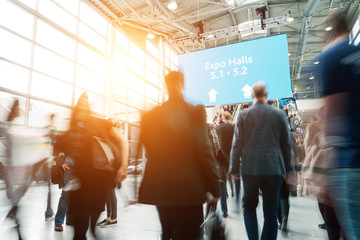 blurred visitors at a trade fair