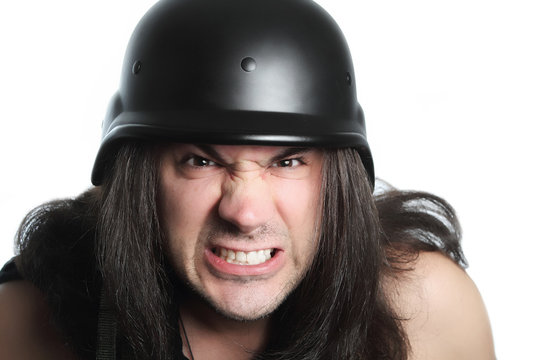 angry man with long hair and police helmet