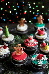 Homemade Christmas sweet cupcakes on wooden background,selective focus