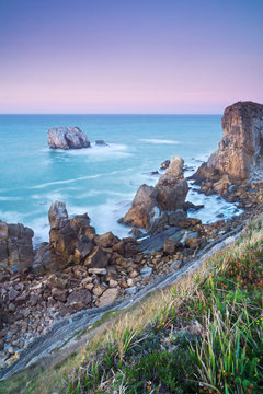 Cliff with detachments at sea