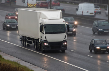 Fototapeta na wymiar Lorry in motion in a rainy weather