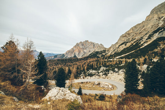mountain pass in the italian alps in autumn with a hairpin curve