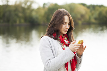 Young brunette woman calling by phone