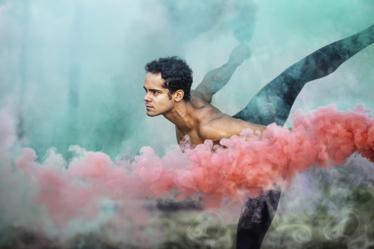 Ballet dancer with smoke bombs