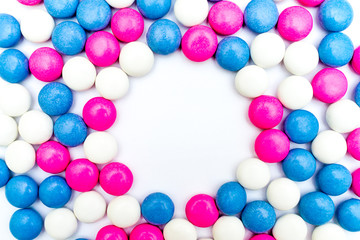 Colored chocolate coated candy on wooden background