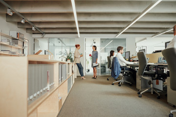 Two business woman meeting in office during break