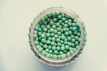 Natural vegetable biologically active additive. In the form of small green balls. Natural medicines from Asia.