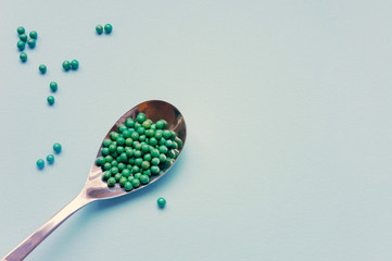 Natural vegetable biologically active additive. In the form of small green balls. Natural medicines from Asia.