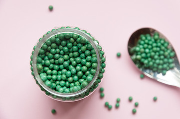 Natural vegetable biologically active additive. In the form of small green balls. Natural medicines from Asia.