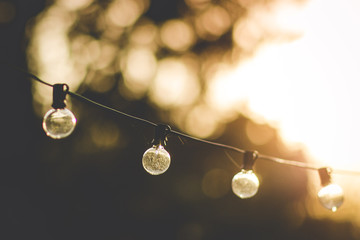 Outdoor globe lights at sunset
