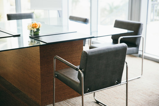 Glass desk and  office chairs in a meeting room