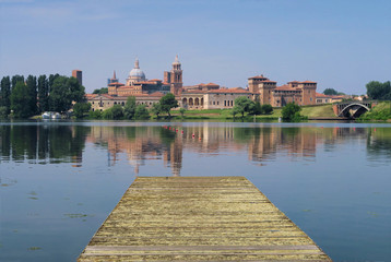 Sunny day over the artificial lake that surrounds the Renaissance architecture city in the ...