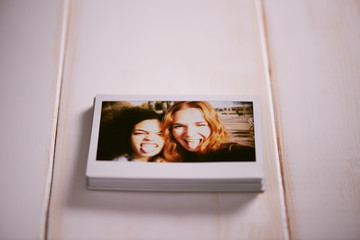 Pile of instant photos of best friends