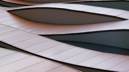 Abstract curved line details on building exterior.