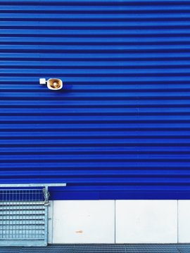 loudspeaker on a blue external wall