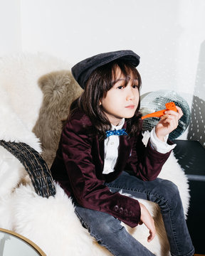 Young stylish boy with plastic bubble pipe