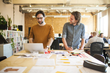 Two designers or creative professionals working in their studio or workplace