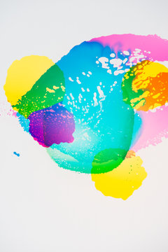 A group of colorful vibrant transparent colors on white.