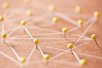 Many yellow pins creating a network