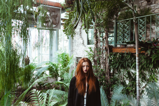 Woman in a greenhouse